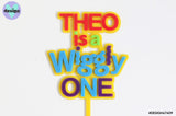 Custom Name is a Wiggly One Layered Cake Topper